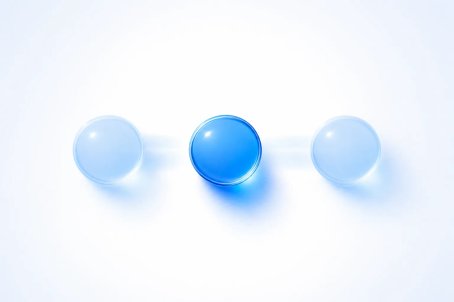 Two identical translucent blue glass tokens approaching from opposite sides of a white field and resolving at the centre into a single brighter token no larger than either original.